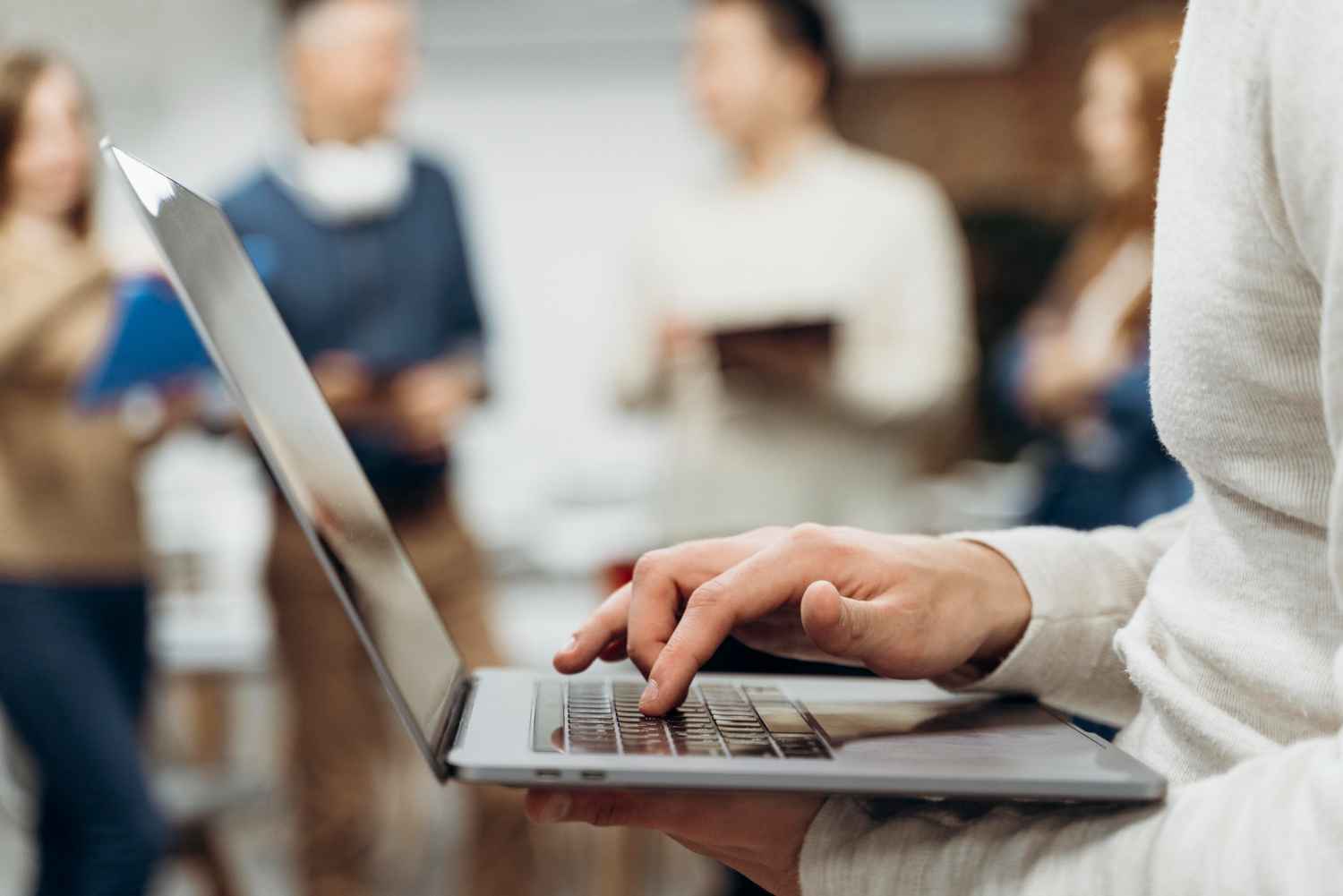 man-working-laptop-while-standing_11zon