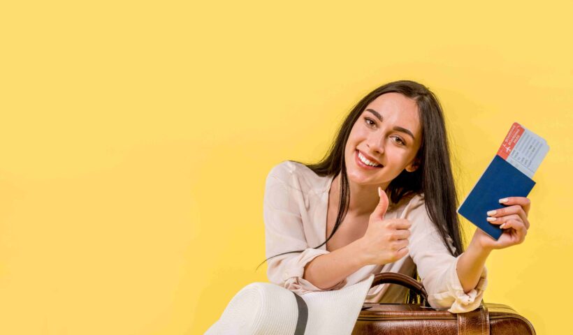 woman-with-tickets-giving-thumb-up (1)_11zon