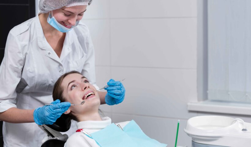 female-dentist-performing-dental-check-patient (2)