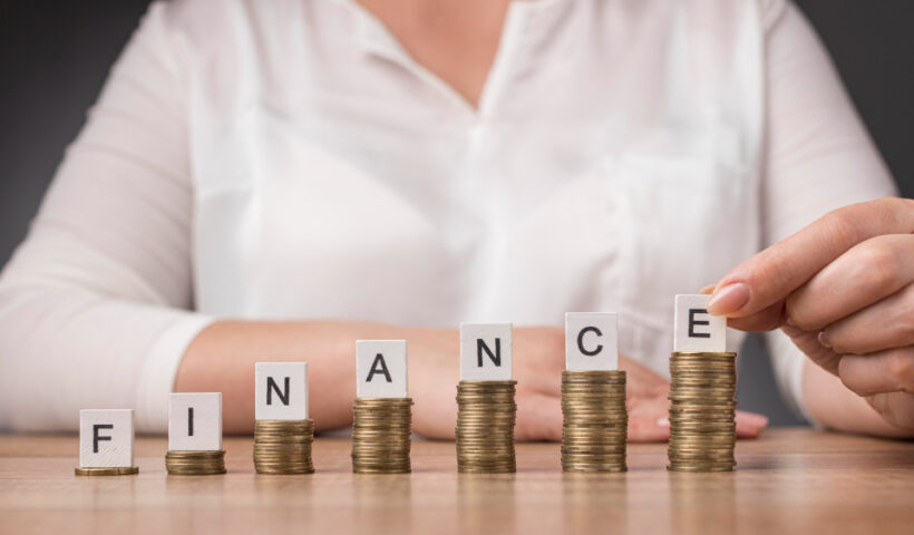 arrangement-pile-coins-with-finance-word