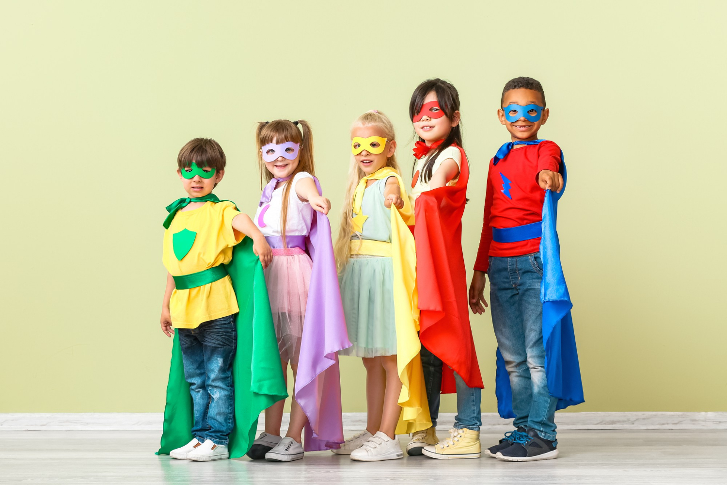 cute-little-children-dressed-as-superheroes-near-color-wall