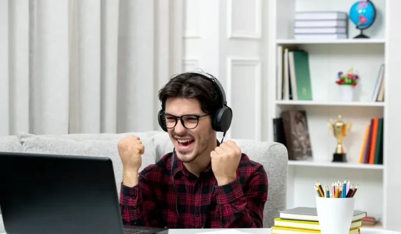 student-online-young-guy-checked-shirt-with-glasses-studying-computer-excited-with-fists-up_20