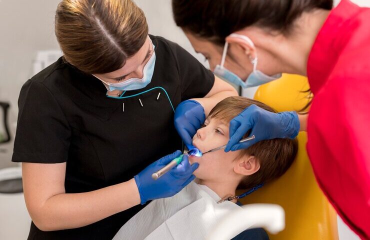 dentist-cleaning-child-s-teeth_23-2149195903