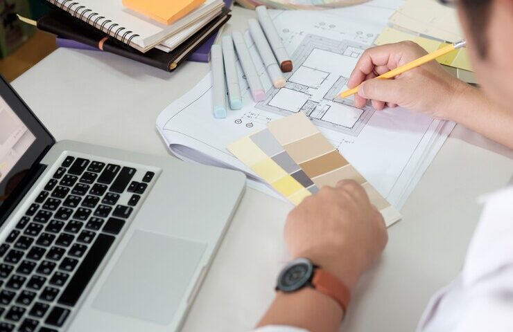 graphic-design-color-swatches-pens-desk-architectural-drawing-with-work-tools-accessories_1421-387