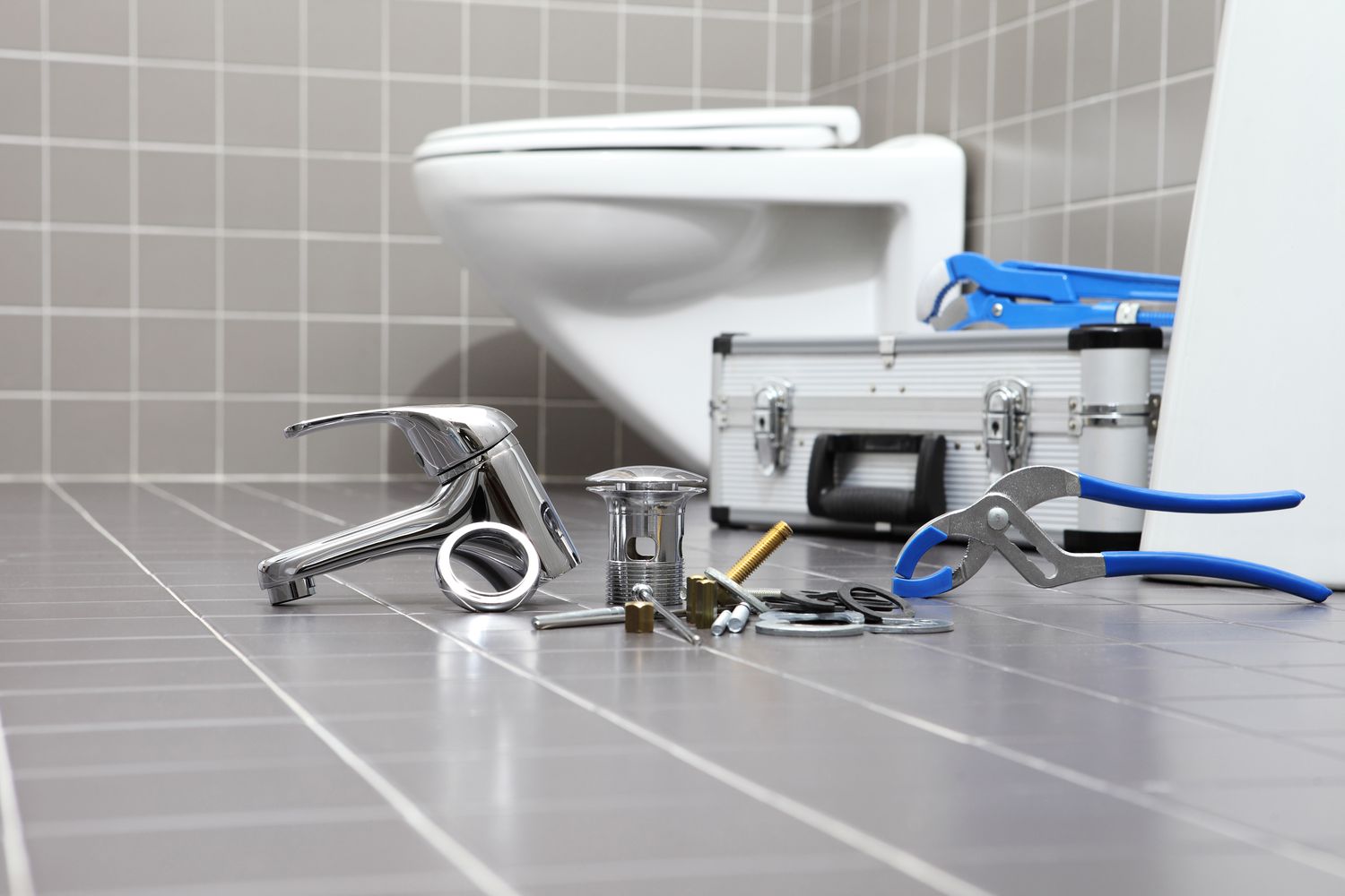 plumber-tools-and-equipment-in-a-bathroom--plumbing-repair-service--assemble-and-install-concept-914972980-0fe9cab0e1a04a3089235dc3666a7ec3