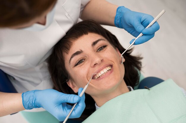young-female-patient-having-dental-procedure-orthodontist_23-2148985752